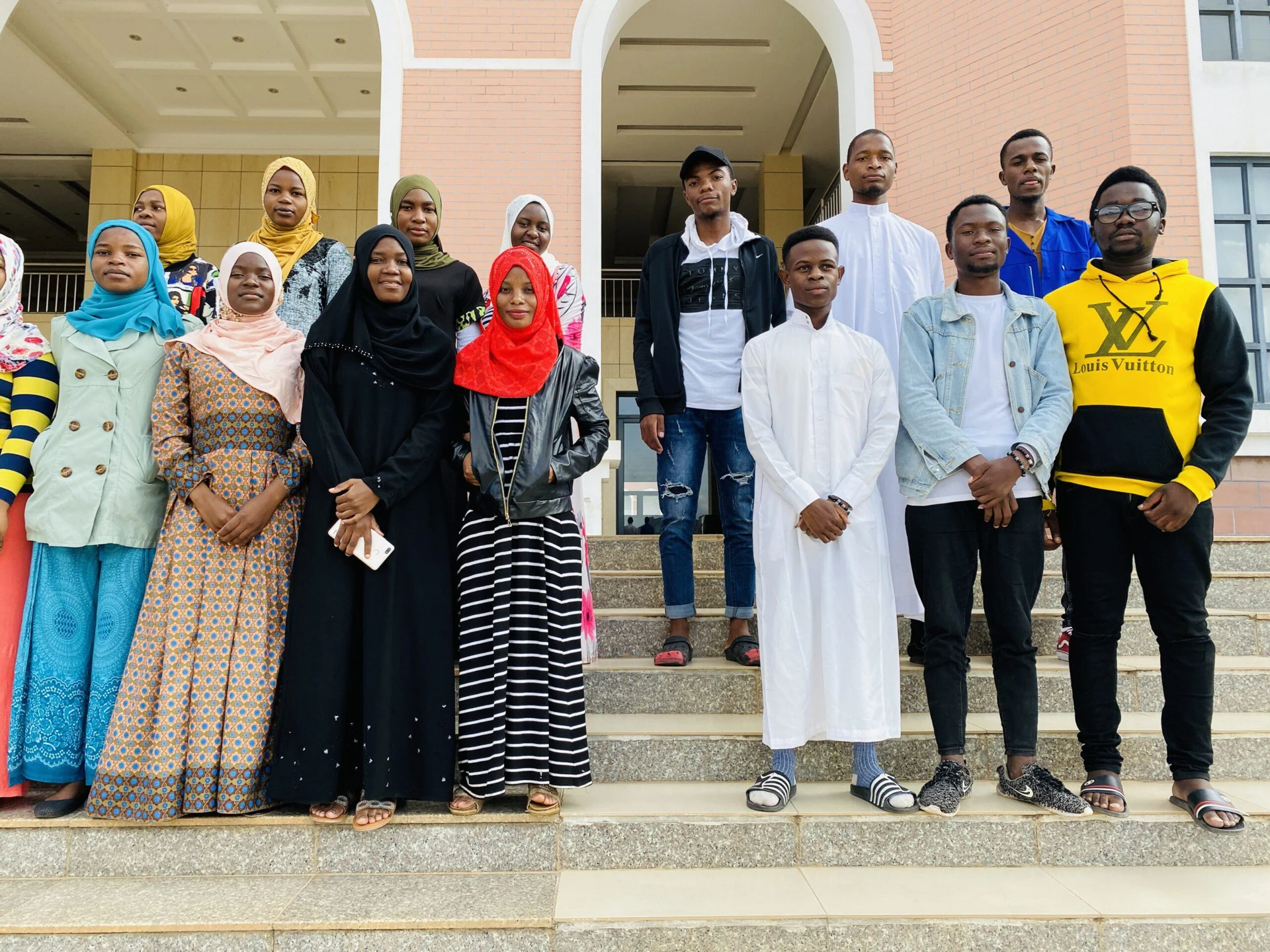 Students supported by Islamic Zakaat Fund standing outside a college
