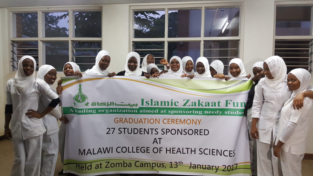 student holding izf flayer