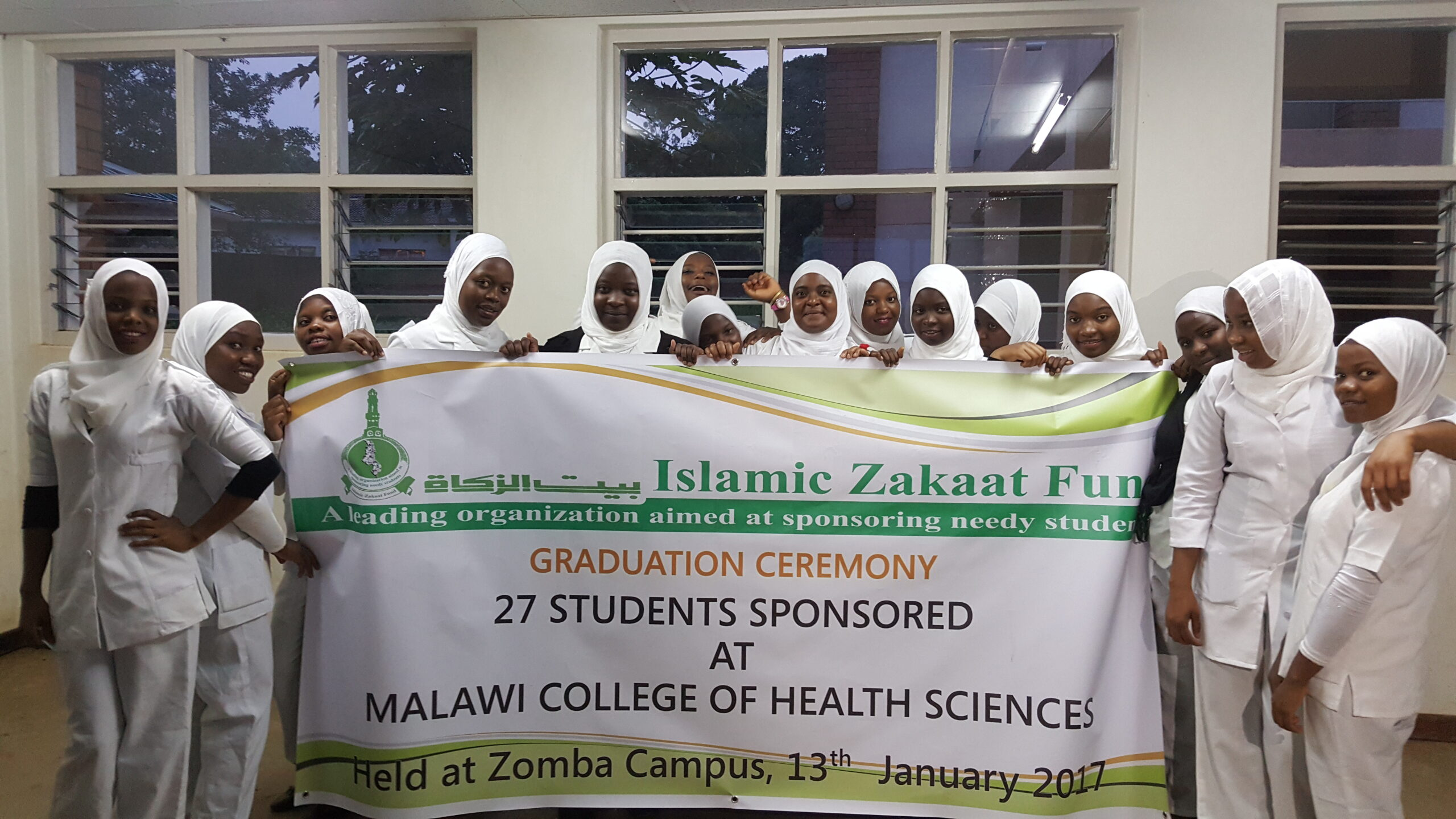 student holding izf flayer